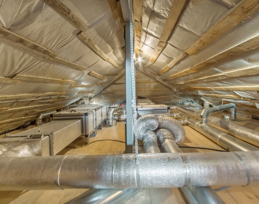 Ducts right underneath roof of building