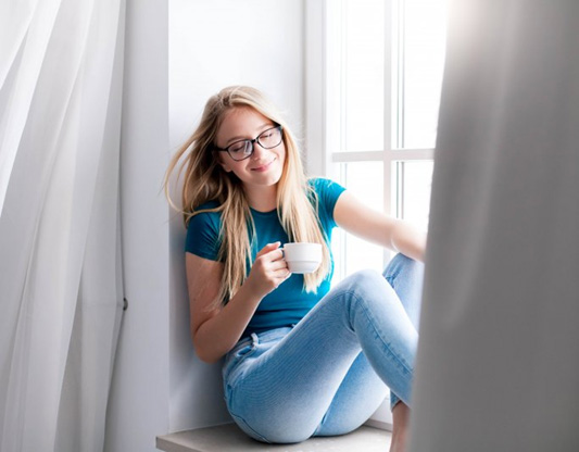 a woman enjoying good air conditioning at home