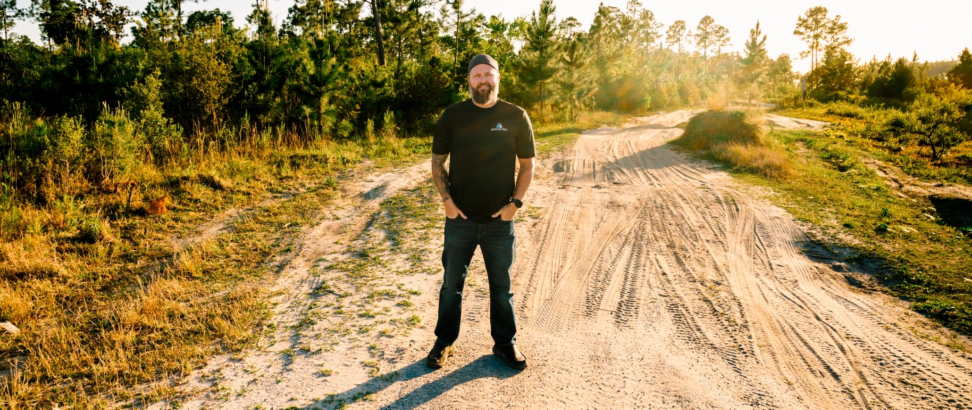 Panama City Florida H V A C contractor Joe smiling and standing against white pickup truck