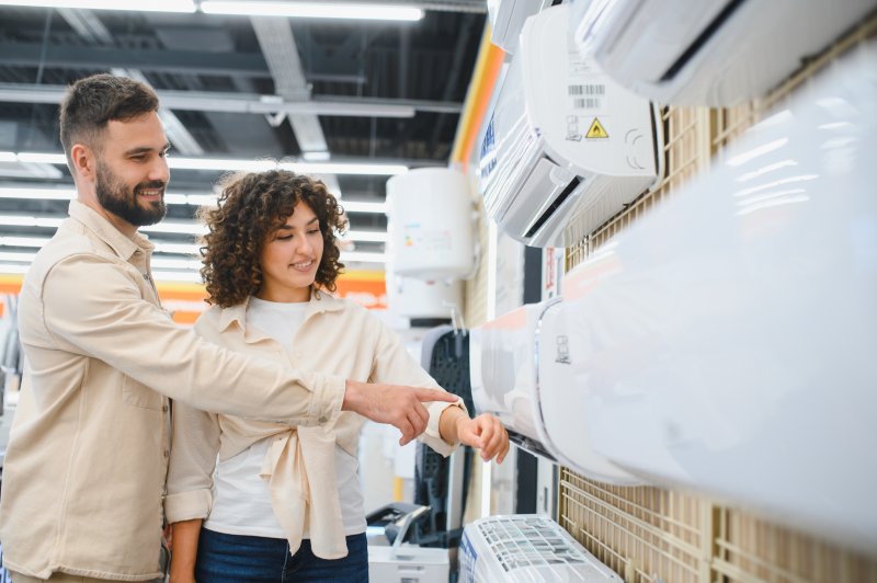 a couple shopping for an HVAC unit
